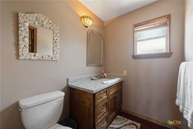 616 N Shore Dr, Port Mansfield, TX 78598 - bathroom featuring vanity, toilet, and baseboards
