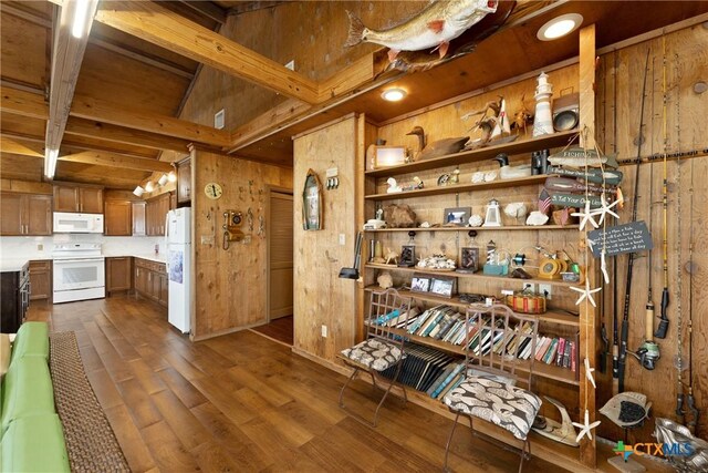 616 N Shore Dr, Port Mansfield, TX 78598 - interior space with wooden walls, dark wood-type flooring, and beam ceiling