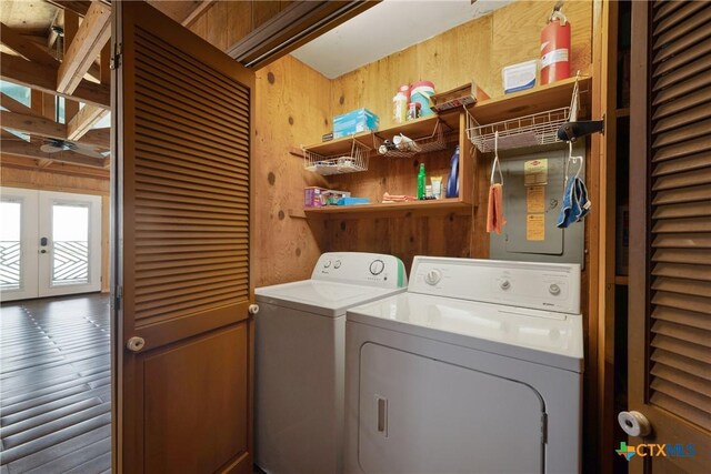 616 N Shore Dr, Port Mansfield, TX 78598 - washroom featuring wooden walls, washer and clothes dryer, and french doors
