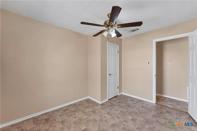 unfurnished bedroom with a ceiling fan, baseboards, and visible vents