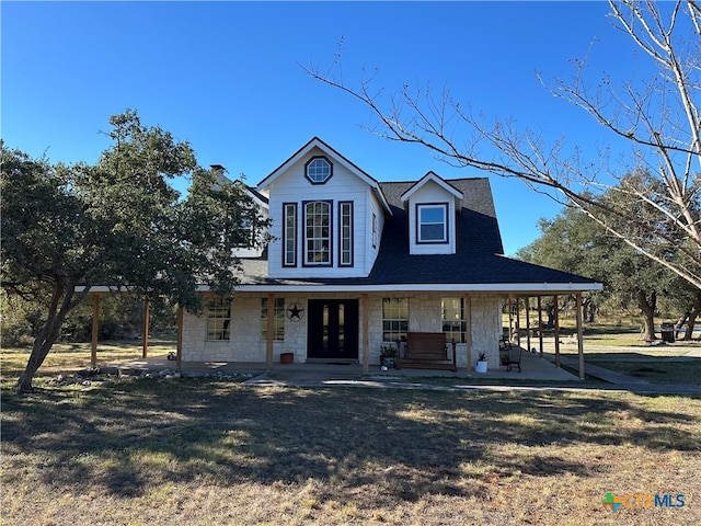 view of front of home featuring a front yard and a porch