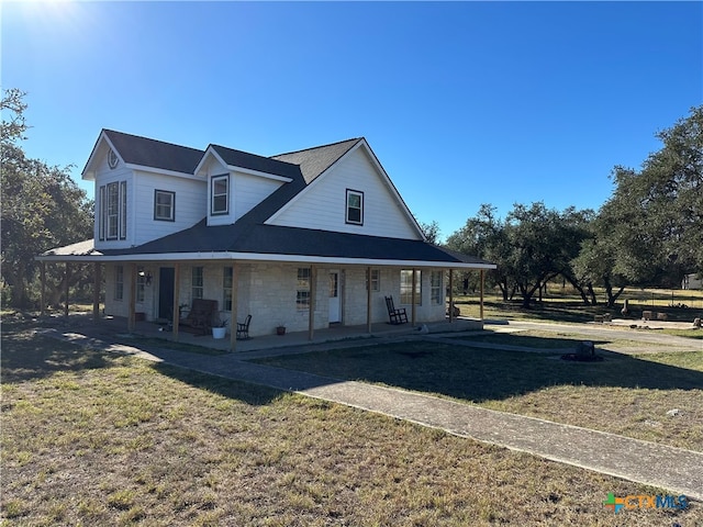 country-style home with covered porch and a front yard