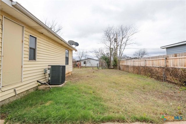 view of yard with central AC unit