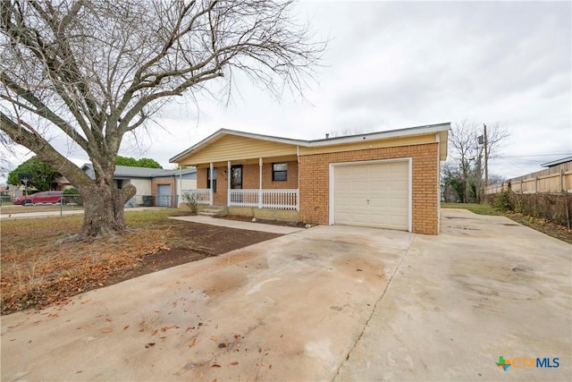 ranch-style house with a porch and a garage