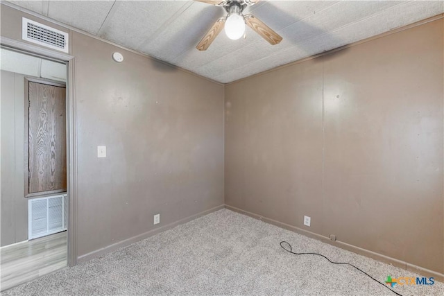 unfurnished room with ceiling fan and light colored carpet