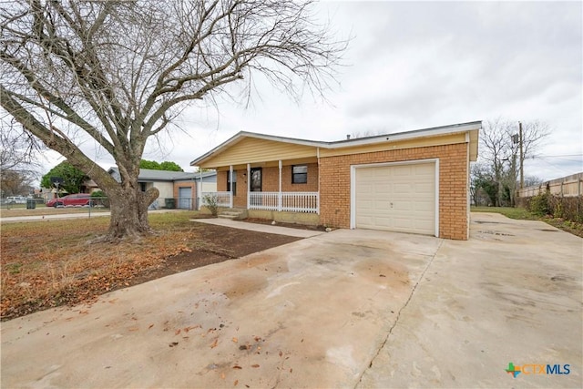 view of front facade featuring a garage and covered porch