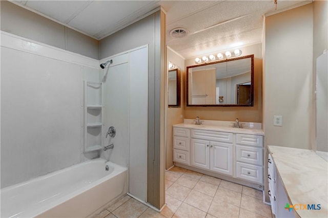 bathroom featuring tile patterned flooring, vanity, ornamental molding, and washtub / shower combination