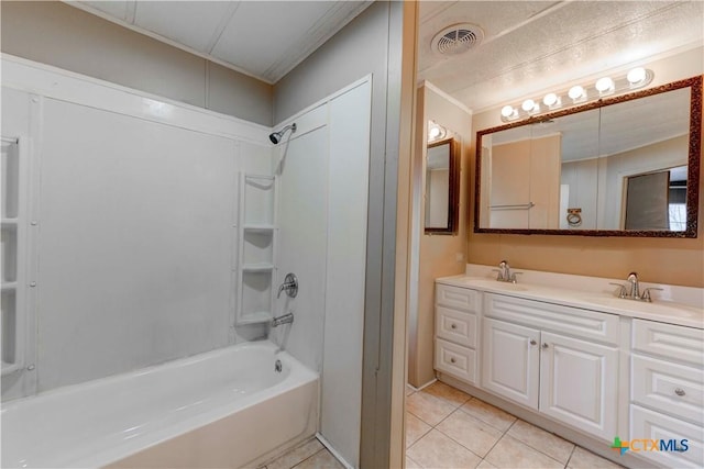 bathroom featuring tile patterned floors, crown molding, vanity, and  shower combination