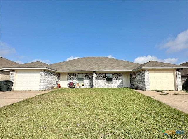 3805 Uvalde Dr, Killeen, TX 76549 - ranch-style house with a garage, driveway, a front lawn, and brick siding