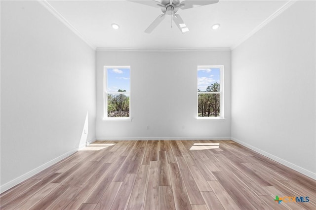 unfurnished room featuring recessed lighting, light wood finished floors, and crown molding