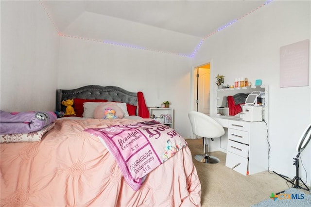 1002 Wallin Farms Cv, Hutto, TX 78634 - carpeted bedroom featuring lofted ceiling