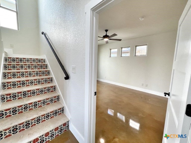 stairway with ceiling fan