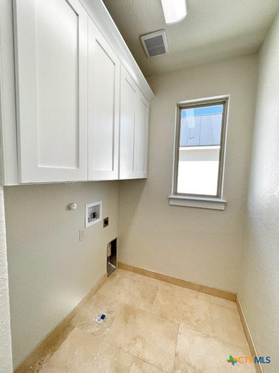 laundry area featuring washer hookup, cabinets, and hookup for an electric dryer