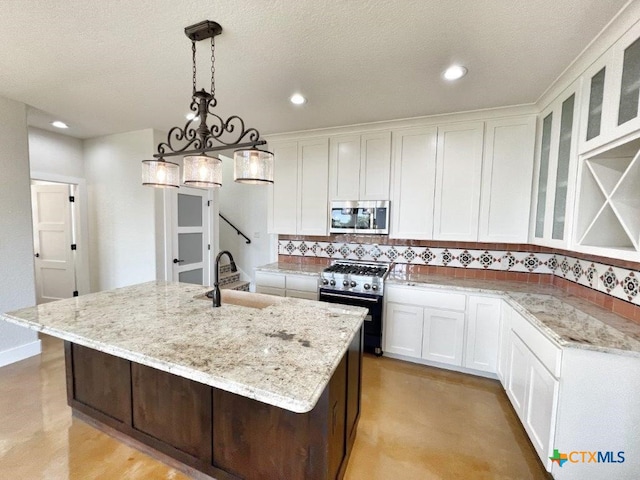 kitchen featuring white cabinetry, a center island with sink, appliances with stainless steel finishes, backsplash, and hanging light fixtures