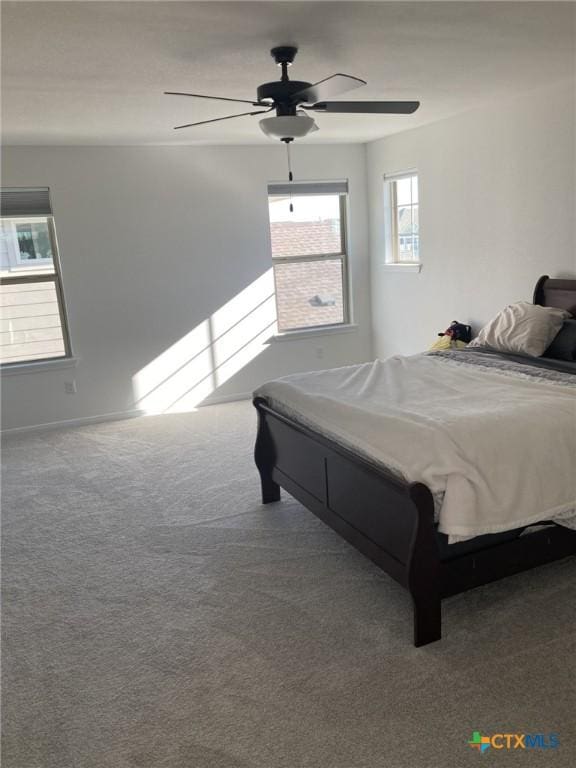 bedroom with carpet flooring and a ceiling fan