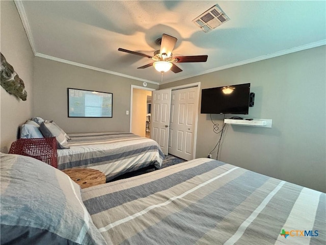 1403 Bill Tindall Ave, Seadrift, TX 77983 - bedroom featuring ceiling fan, crown molding, and a closet
