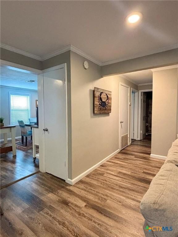1403 Bill Tindall Ave, Seadrift, TX 77983 - corridor with wood finished floors, crown molding, baseboards, and an office area