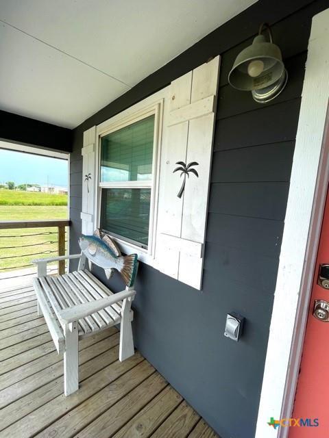 1403 Bill Tindall Ave, Seadrift, TX 77983 - wooden terrace with a porch