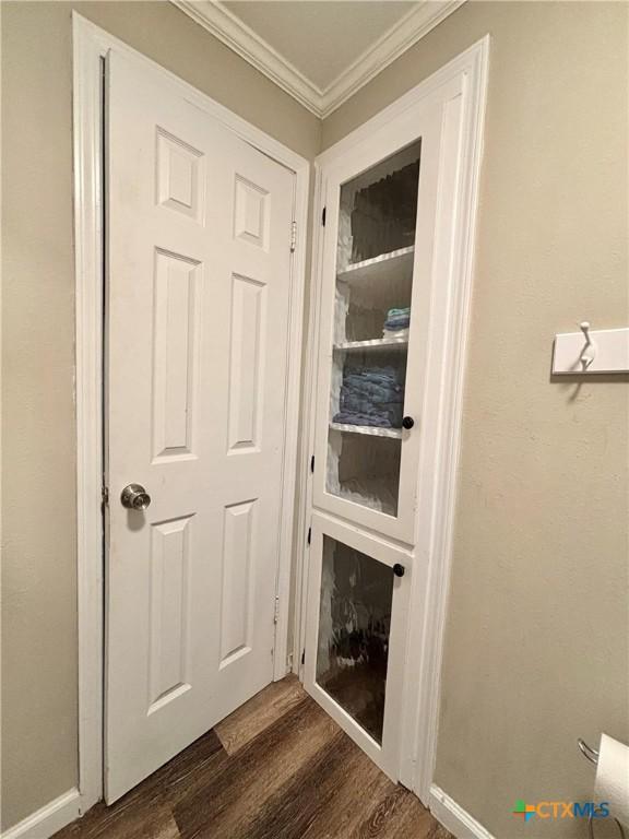 1403 Bill Tindall Ave, Seadrift, TX 77983 - detailed view of wood finished floors, crown molding, and baseboards