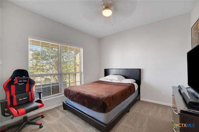 carpeted bedroom featuring ceiling fan