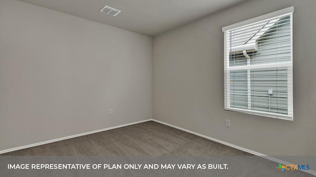 carpeted spare room with baseboards and visible vents