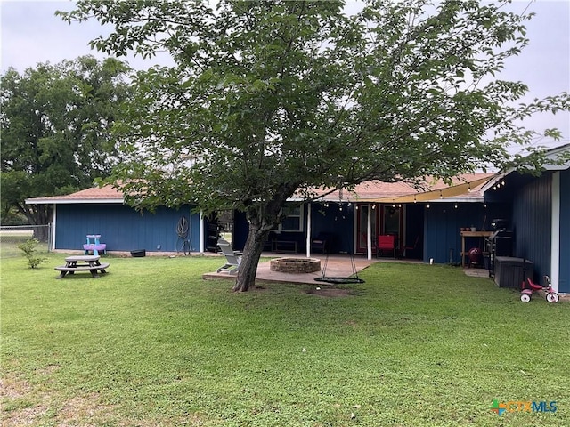 208 Old Fort Gates Rd, Gatesville, TX 76528 - rear view of house featuring a fire pit, a yard, and a patio area