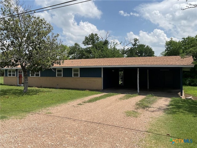 208 Old Fort Gates Rd, Gatesville, TX 76528 - single story home featuring driveway, brick siding, a carport, a front yard, and roof with shingles