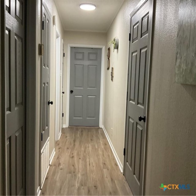 208 Old Fort Gates Rd, Gatesville, TX 76528 - doorway to outside with light wood finished floors and baseboards