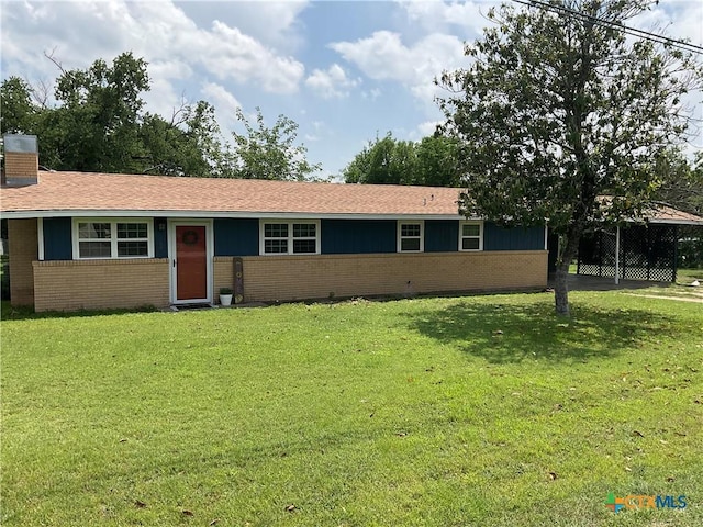 208 Old Fort Gates Rd, Gatesville, TX 76528 - single story home featuring brick siding, a front yard, a chimney, and a shingled roof