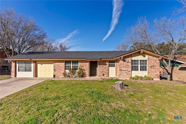 ranch-style home featuring brick siding, an attached garage, concrete driveway, and a front lawn