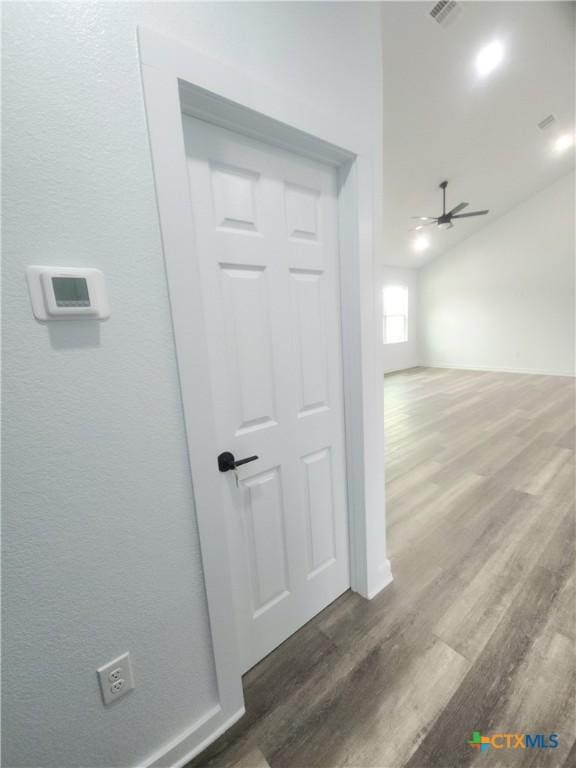 hallway featuring dark hardwood / wood-style flooring