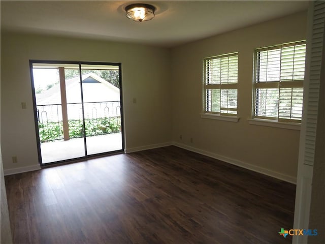213 Tracy Ln, Victoria, TX 77904 - spare room with plenty of natural light and dark wood-style floors