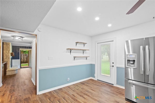 213 Tracy Ln, Victoria, TX 77904 - kitchen featuring stainless steel refrigerator with ice dispenser, wainscoting, wood finished floors, recessed lighting, and a ceiling fan