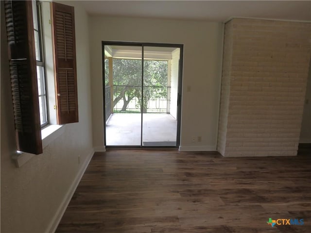 213 Tracy Ln, Victoria, TX 77904 - unfurnished room featuring plenty of natural light and wood finished floors