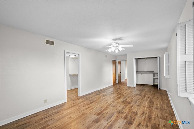 213 Tracy Ln, Victoria, TX 77904 - unfurnished bedroom with wood finished floors and ceiling fan