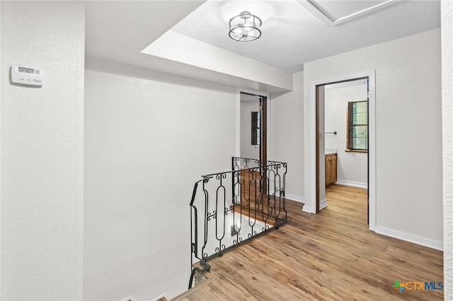 213 Tracy Ln, Victoria, TX 77904 - corridor featuring an upstairs landing and wood finished floors