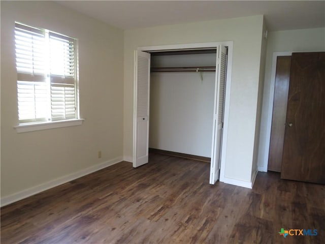 213 Tracy Ln, Victoria, TX 77904 - unfurnished bedroom with a closet and wood finished floors