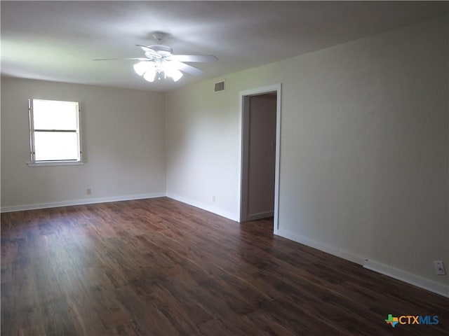 213 Tracy Ln, Victoria, TX 77904 - empty room featuring a ceiling fan and dark wood-style floors