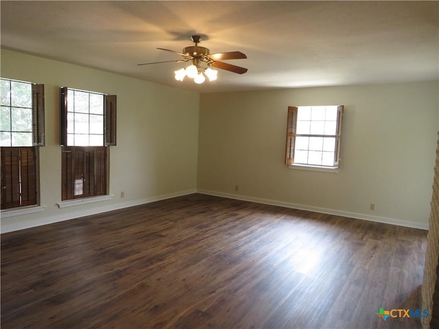 213 Tracy Ln, Victoria, TX 77904 - empty room featuring plenty of natural light, dark wood-style floors, and ceiling fan