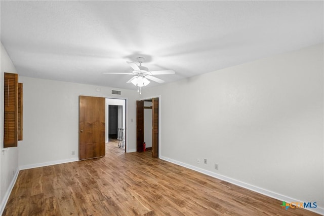 213 Tracy Ln, Victoria, TX 77904 - spare room with ceiling fan and wood finished floors
