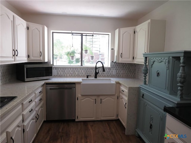 213 Tracy Ln, Victoria, TX 77904 - kitchen featuring appliances with stainless steel finishes, healthy amount of natural light, and tasteful backsplash