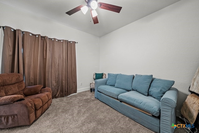 living room featuring carpet flooring, ceiling fan, and lofted ceiling