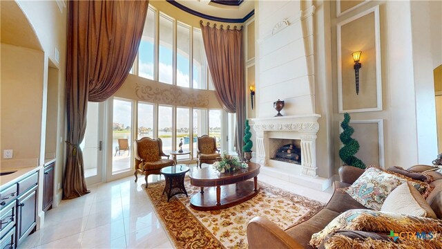 living area with a towering ceiling and a healthy amount of sunlight