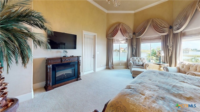 carpeted bedroom with ornamental molding