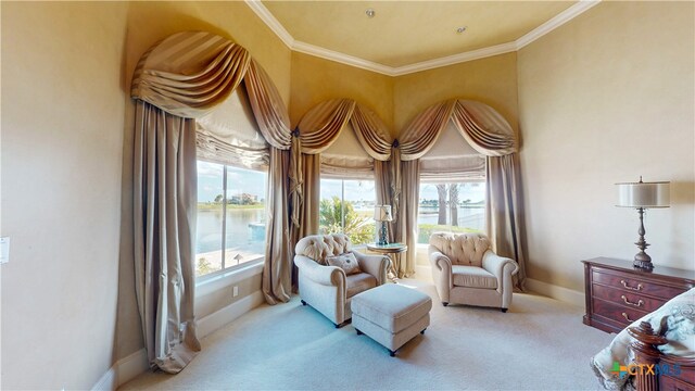 living area with a water view, light colored carpet, and crown molding