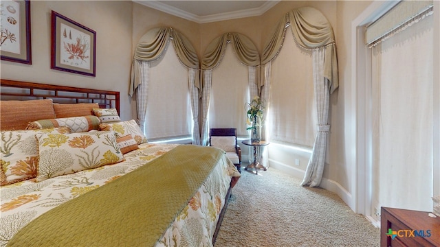 carpeted bedroom with ornamental molding