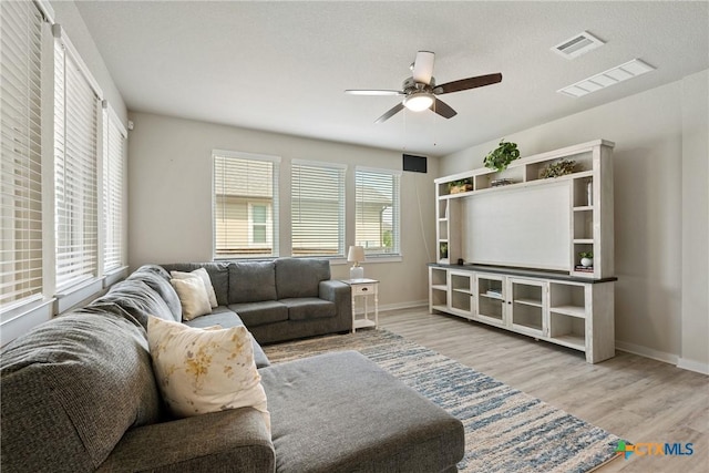 2917 Sage Ranch Dr, Leander, TX 78641 - living area with a ceiling fan and wood finished floors