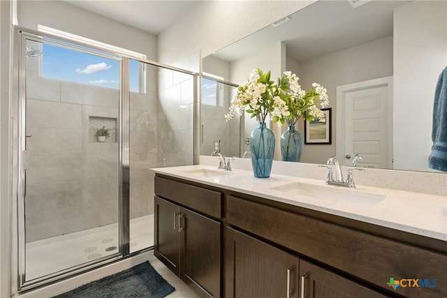 2917 Sage Ranch Dr, Leander, TX 78641 - full bathroom featuring double vanity and a stall shower
