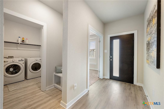 2917 Sage Ranch Dr, Leander, TX 78641 - laundry room featuring washing machine and dryer and wood finished floors
