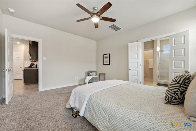 2917 Sage Ranch Dr, Leander, TX 78641 - bedroom with light carpet, ensuite bath, and a ceiling fan
